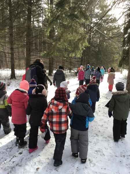 school-age kids on a winter hike
